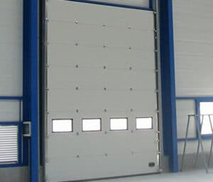 porte sectionnelle grande dimension industrie entreprise Mayenne